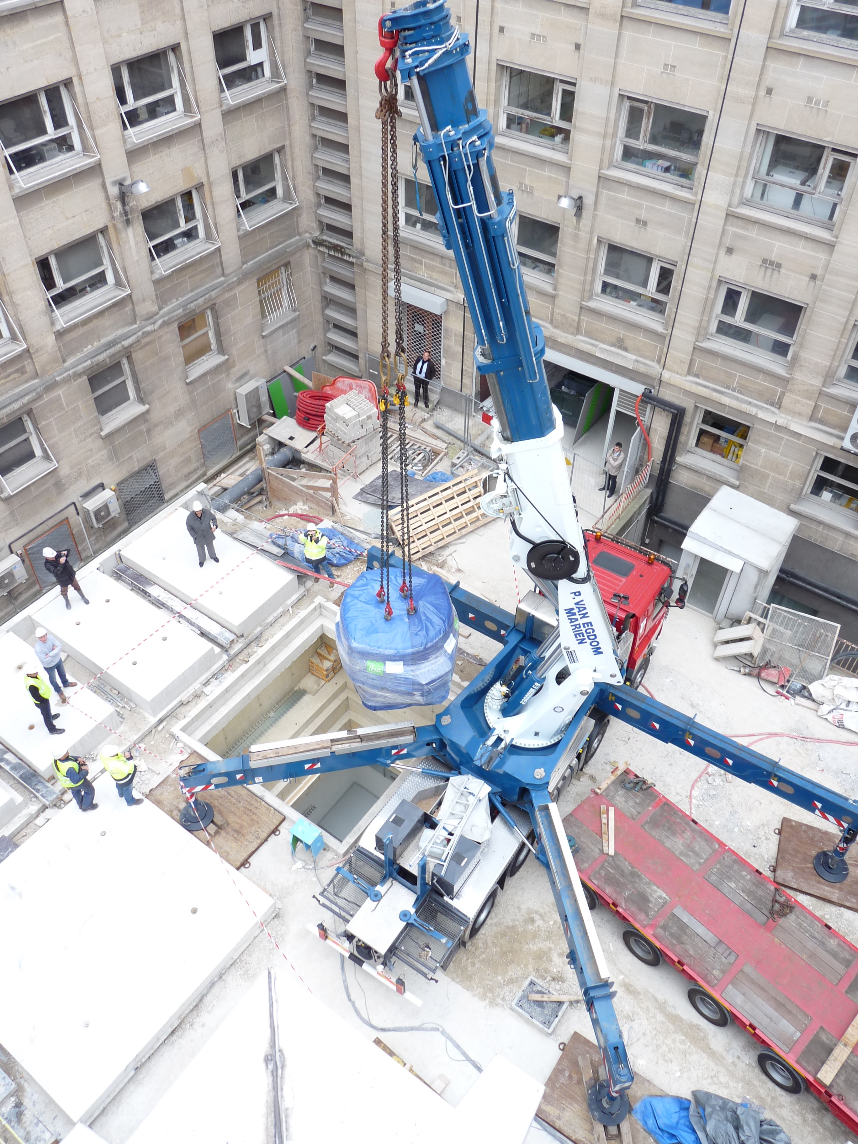 Lowering cyclotron through roof of bunker